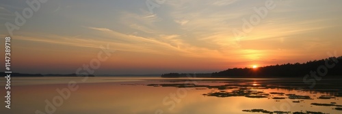 A stunning sunset over a calm lake with vibrant colors reflecting in the water, scenes, beauty, peaceful