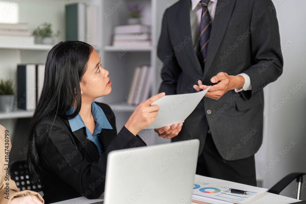 Business Team Collaborating on Data Analysis with Graphs and Charts in a Modern Office Setting Business Team Collaborating on Data Analysis with Graphs and Charts in a Modern Office Setting