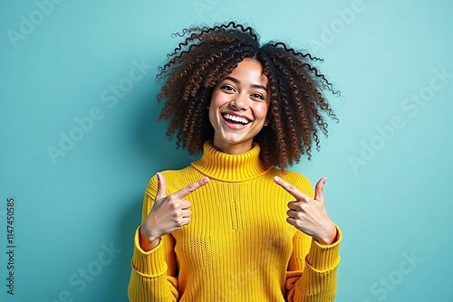 Young Black Woman Smiling and Gesturing in Style with a Yellow Knit Sweater photo