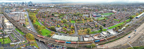 Aerial High Resolution Panoramic View of Manchester City During Autumn Season and Cloudy Day over England Great Britain. High Angle Drone's Camera Footage was Captured on October 29th, 2024 photo