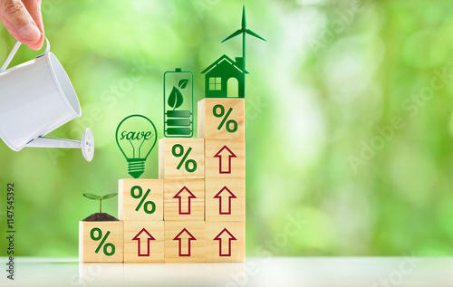 Nurturing Sustainability: Investing in renewable energy and energy-efficient practices leads to significant savings and environmental benefits. A hand holding a watering can nurturing a small plant.