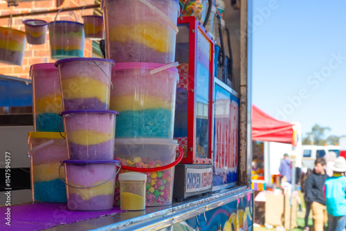 Buckets of colourful fairy floss at a country show photo