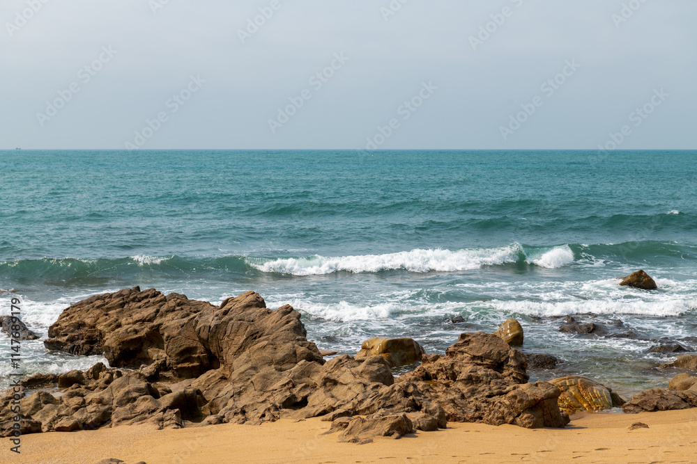 The coastal scenery at Xiaodongtian Scenic Area in Sanya City, Hainan Province, China. The coastal scenery at Xiaodongtian Scenic Area in Sanya City, Hainan Province, China.