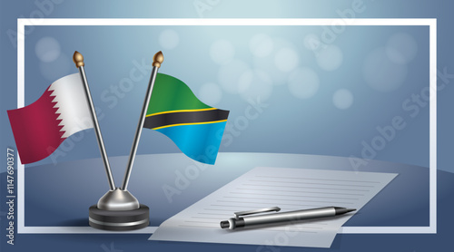 Qatar and Tanzania National flags on small table with bokeh background, cooperative relationship