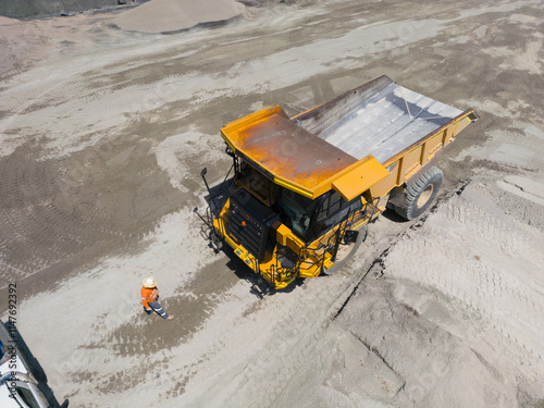 Aerial view of a dump truck in a quarry.