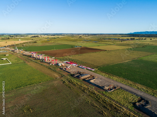 Aerial view of beginnings of bypass highway road under construction in farmland
