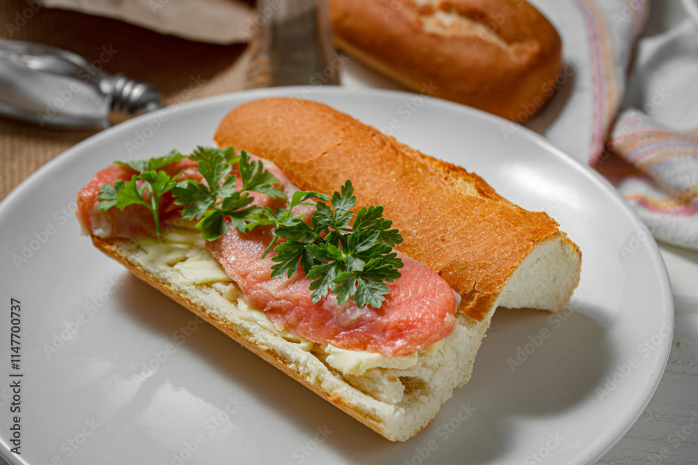 Sandwich with smoked red fish on a light table Sandwich with smoked red fish on a light table