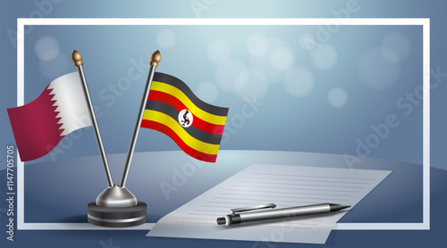 Qatar and Uganda National flags on small table with bokeh background, cooperative relationship