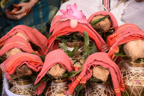 array of kumbums or sacred kudams of holy water kept in puja in sashtiyapthapurthi or sadhabishekam photo