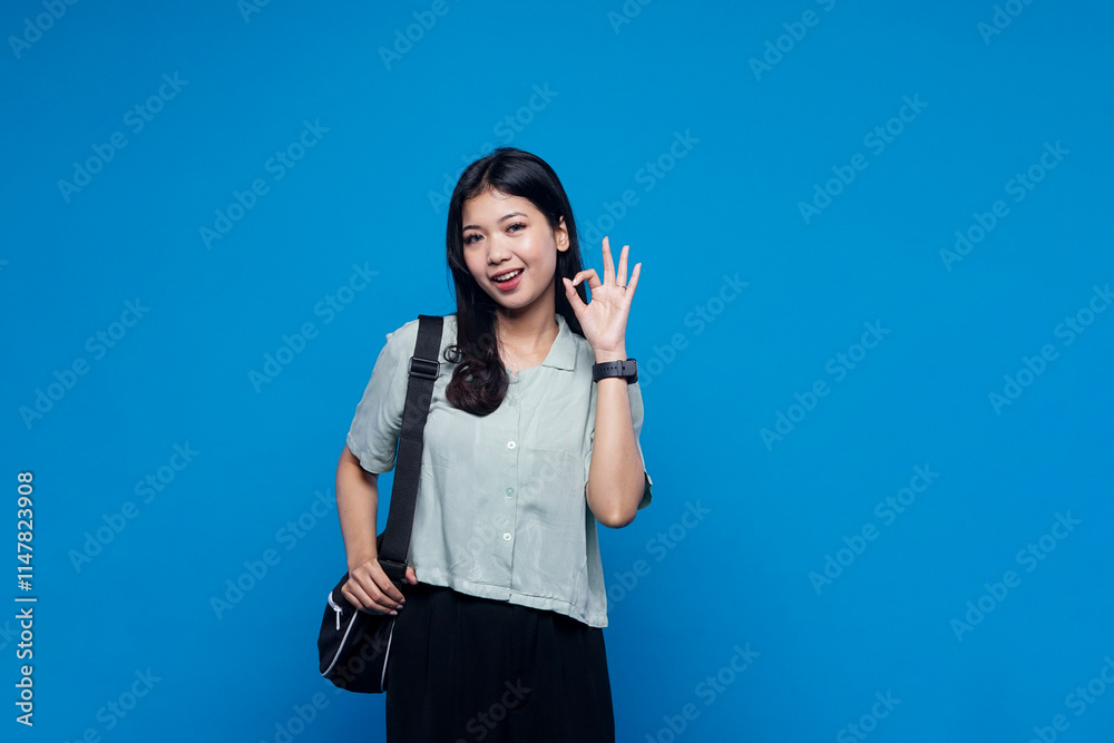 Smilling young woman with gesturing okay Smilling young woman with gesturing okay