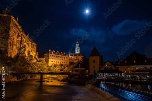 Beautiful town of Český Krumlov on the Vltava River in the full moon night Czech Republic