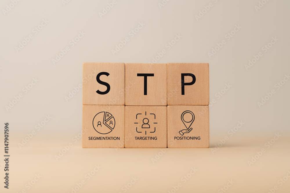 Segmentaion, targeting, positioning .STP Marketing Model. Wooden blocks with STP icons. Identify different customer groups, select groups to prioritize, and create brand’s unique value proposition. Segmentaion, targeting, positioning .STP Marketing Model. Wooden blocks with STP icons. Identify different customer groups, select groups to prioritize, and create brand’s unique value proposition.