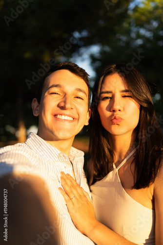 Happy young couple taking a selfie after getting engaged on valentine's day