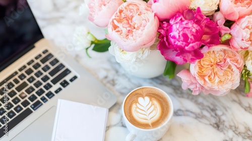 Fototapeta Naklejka Na Ścianę i Meble -  Laptop, coffee, notepad, and peony flowers on marble table.