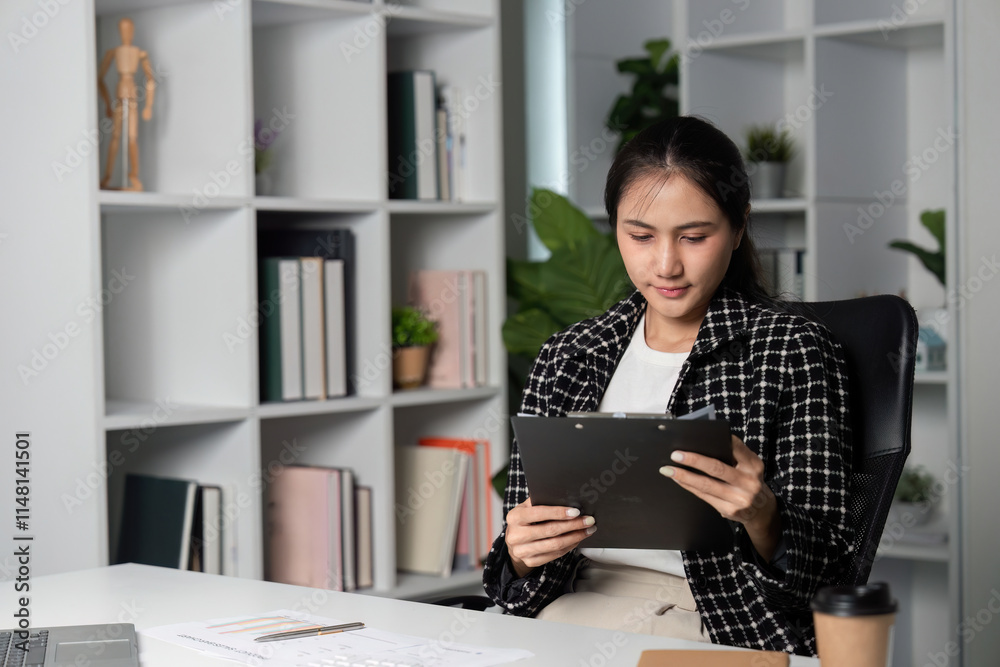 Dedicated Businesswoman Working Late Hours in Modern Office with Technology and Documents