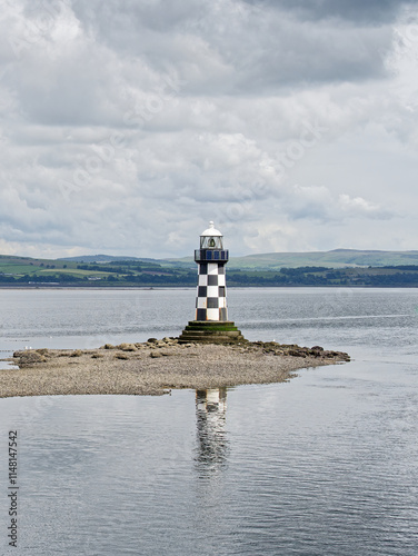 Lighthouse with black and white chequer design photo