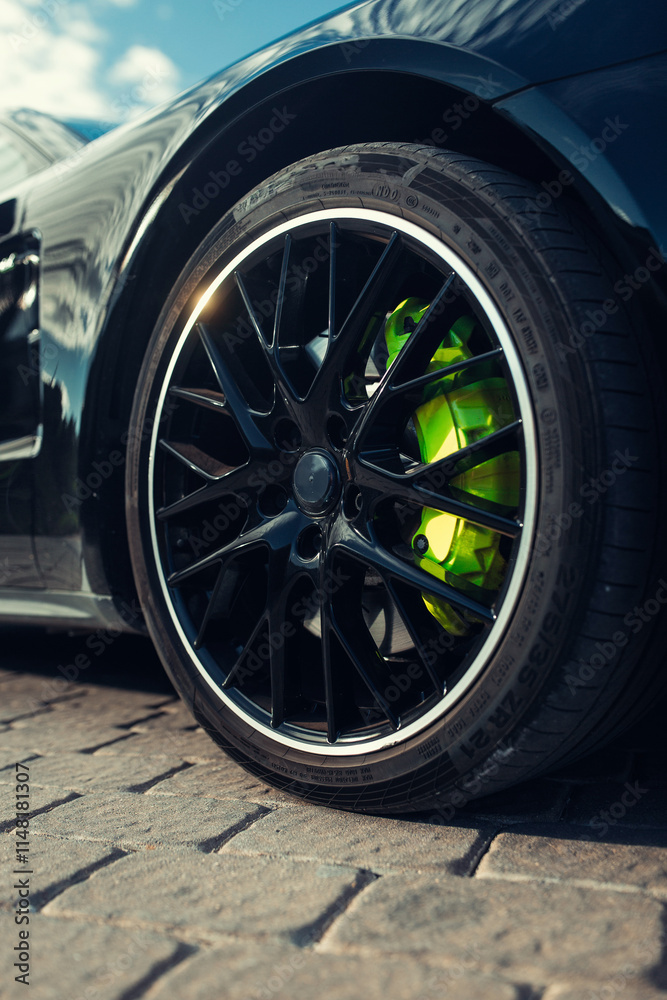 Front wheel of modern car with a rims and tyre Front wheel of modern car with a rims and tyre