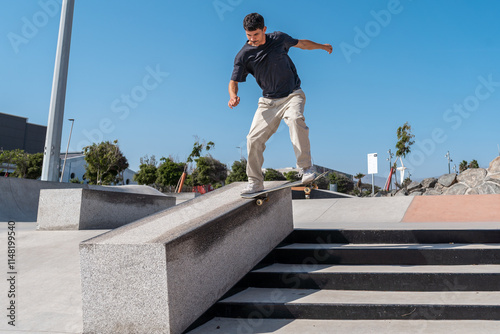 young skater wearing black tshirt jumps a staircase in a sunny day. movement 3 photo