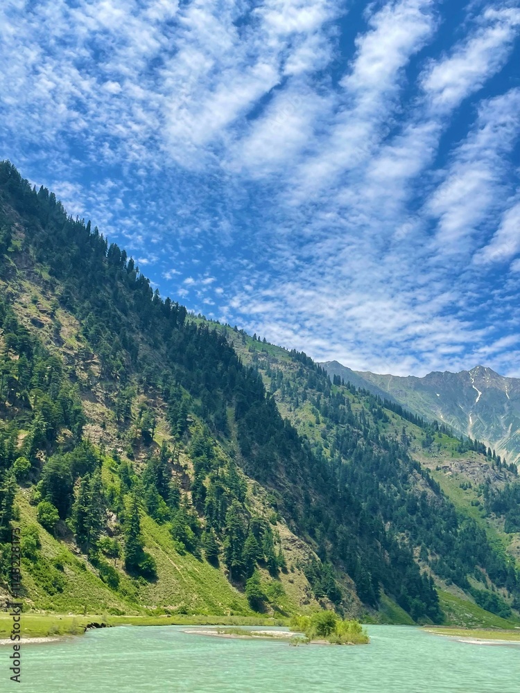 Fototapeta premium Serene Mountain Landscape with River and Blue Sky