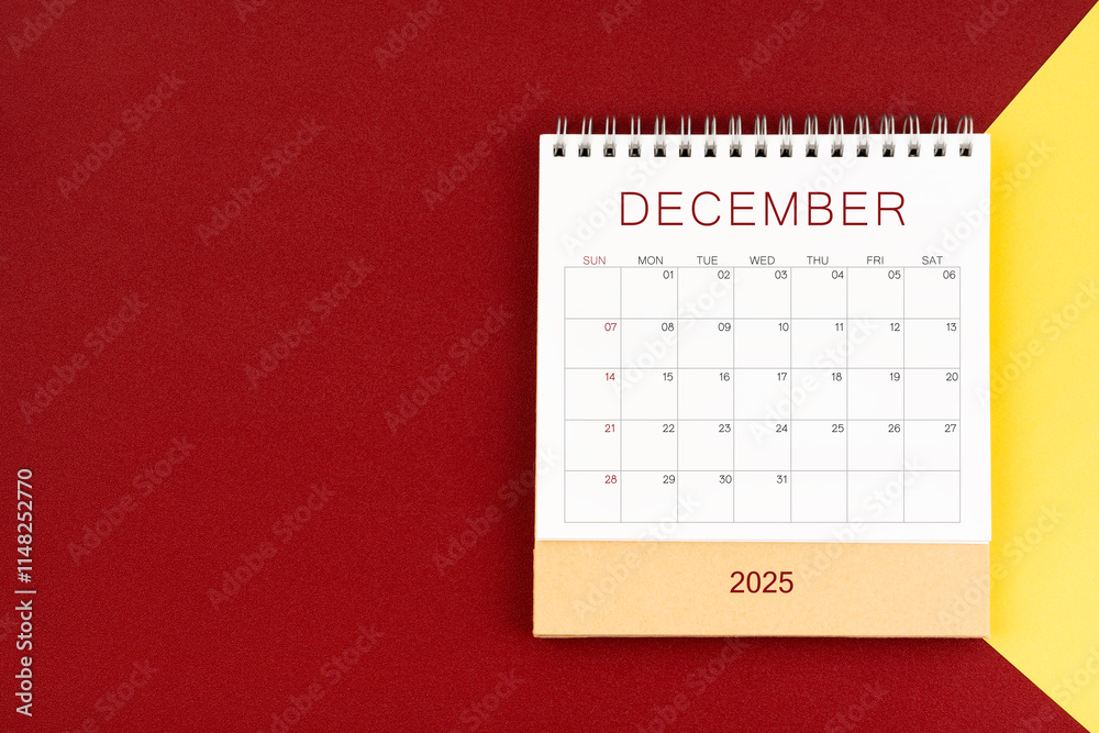 December 2025 blank desk calendar on red and yellow color background. December 2025 blank desk calendar on red and yellow color background.