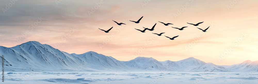 Fototapeta premium Flying birds over snowy mountains at sunset create serene landscape