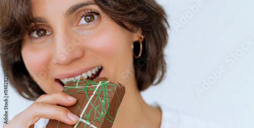 Photography Close up of woman portrait eating Dubai chocolate with green pistachio paste, cream and kataifi dough isolated on white background