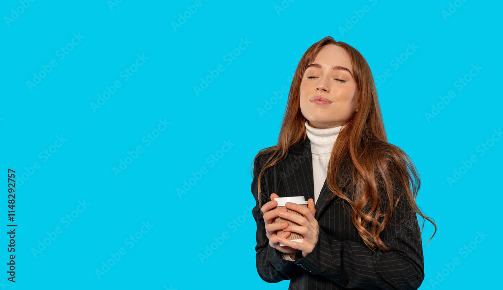 Woman enjoying coffee in a stylish outfit against a bright blue background Woman enjoying coffee in a stylish outfit against a bright blue background