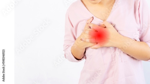 Young woman pressing on chest with painful expression. Severe heartache, having heart attack or painful cramps, heart disease.Coronary artery disease (CAD) 