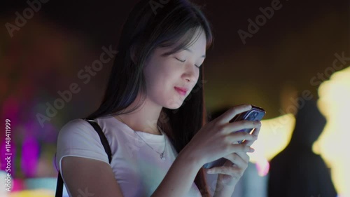 Woman using smartphone at night, Night lights, Bokeh of lights.