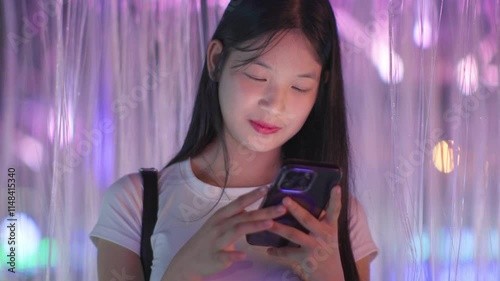 Woman using smartphone at night, Night lights, Bokeh of lights.