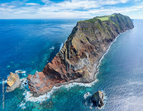 Aerial panoramic view of Lighthouse Farol dos Rosais at West Cape of Sao Jorge Island (Azores, Portugal) photo