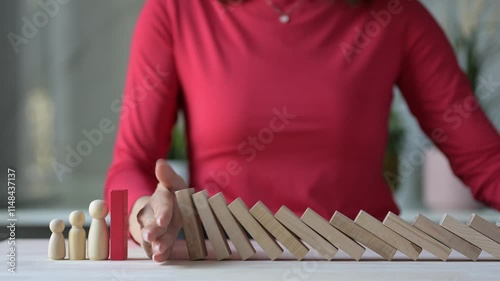 Crisis Management in Business Risk Mitigation Strategies to Prevent Domino Effect Disruptions Office Setting Visual Representation Focus on Hand Stopping Risks