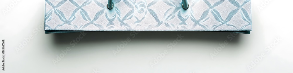 Elegant light blue shopping bag with subtle patterns, isolated from a top view on a clean white background, high resolution. Elegant light blue shopping bag with subtle patterns, isolated from a top view on a clean white background, high resolution.