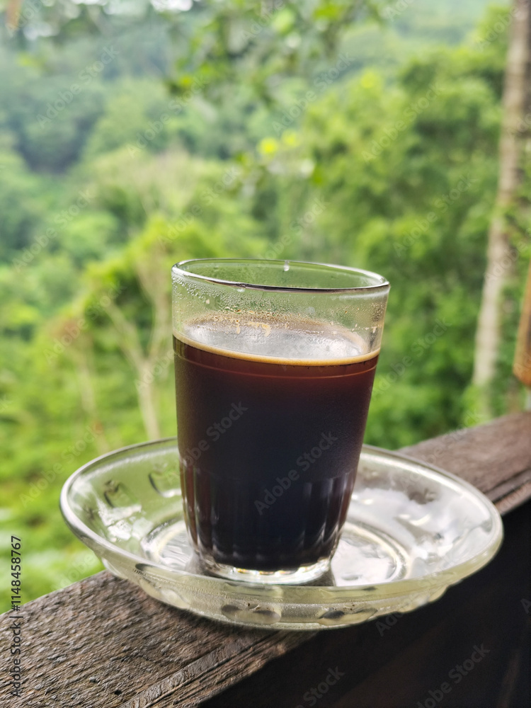 A cup of coffee while enjoying the beautiful mountain view. A cup of coffee while enjoying the beautiful mountain view.