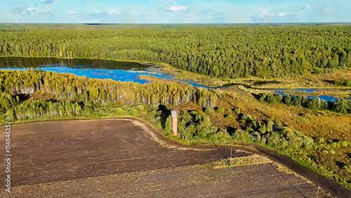 Ekaterinburg, Russia. Watercolor illustration. Old water tower on the edge of the field. Evening time. Early autumn. MasterShots - Dronie - Circle (Far), Aerial View photo