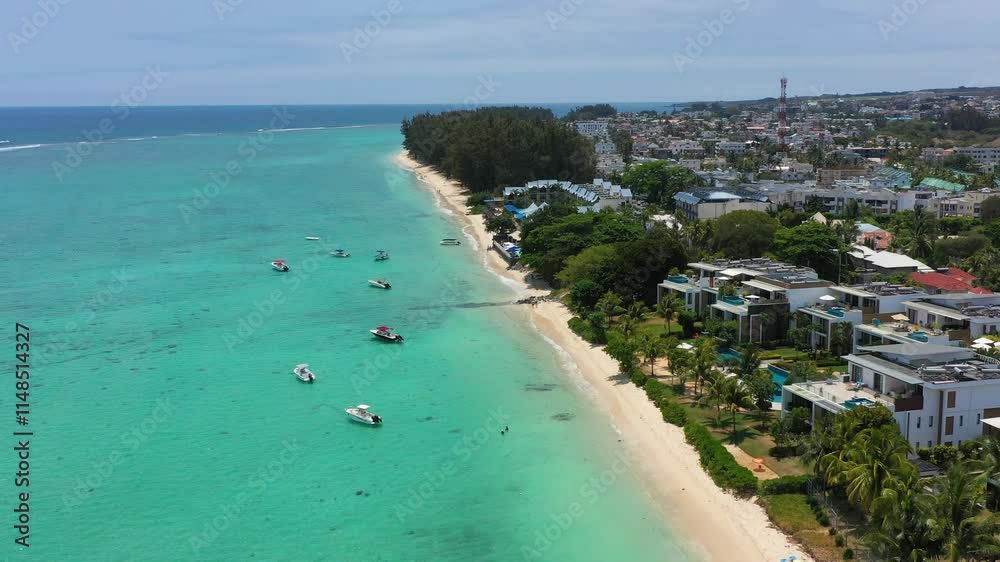 Beautiful Mauritius Island with gorgeous beach Flic en Flac, aerial view from drone. Mauritius, Black River, Flic-en-Flac view of oceanside village beach and luxurious hotel in summer. Beautiful Mauritius Island with gorgeous beach Flic en Flac, aerial view from drone. Mauritius, Black River, Flic-en-Flac view of oceanside village beach and luxurious hotel in summer.
