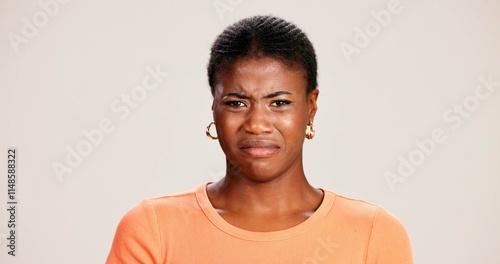Tableau sur toile Black woman, portrait and expression in studio for disgust, disapproval and reaction to smell