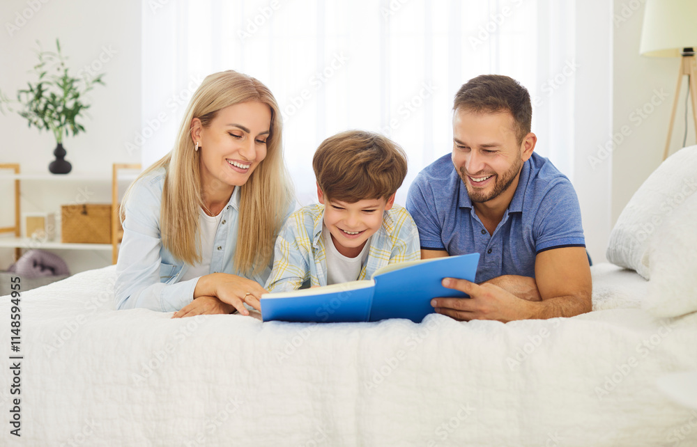 Happy loving family at home, smiling father, mother holding and reading book on bed, parents with cute little child son, mum, dad telling small kid funny fairy tale story, album watching remembering Happy loving family at home, smiling father, mother holding and reading book on bed, parents with cute little child son, mum, dad telling small kid funny fairy tale story, album watching remembering