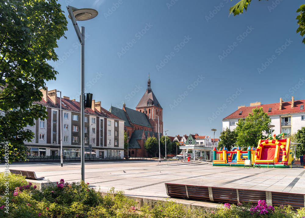 Summer cityscape of Koszalin, West Pomerania (Zachodniopomorskie), Poland. Old Town square (Koszaliński Rynek Staromiejski) with Town Hall (Ratusz) and Cathedral