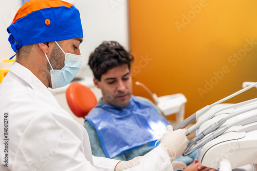 Dentist preparing tools for dental check up on patient