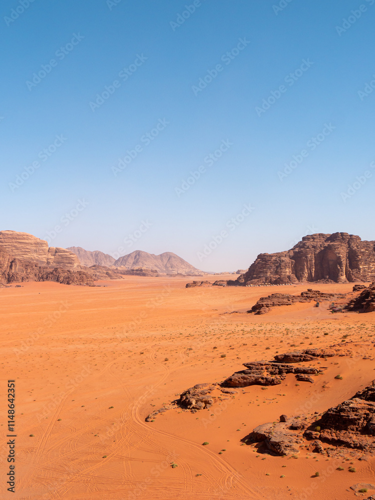 Desert Landscape in Wadi Rum, Jordan on a clear day - Portrait Shot Desert Landscape in Wadi Rum, Jordan on a clear day - Portrait Shot