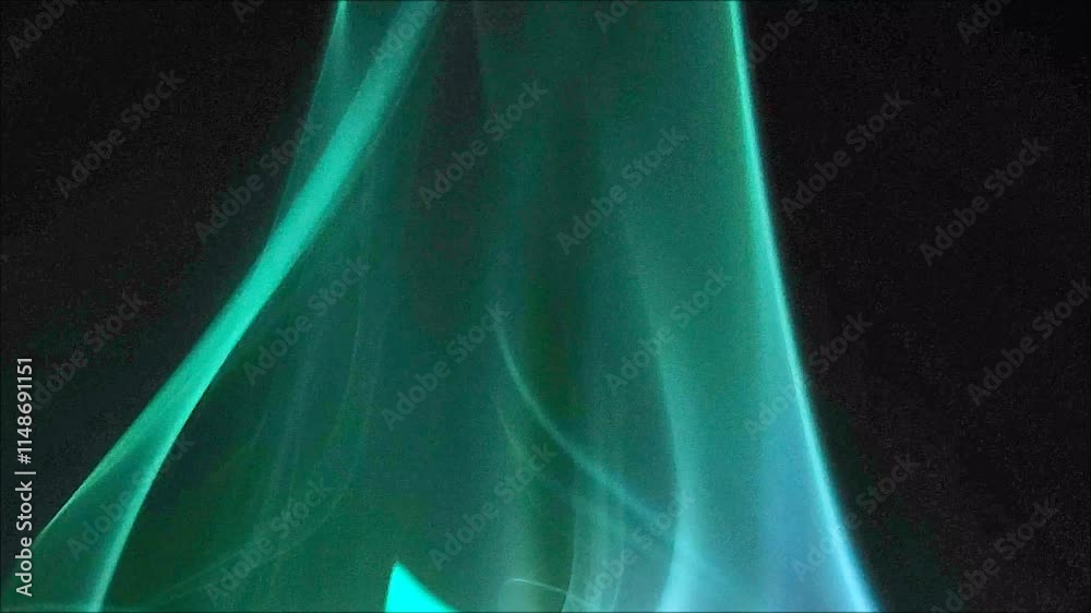 Green abstract background with smooth smoke. Elegance and luxury, textile satín silk clothes and fashion concept