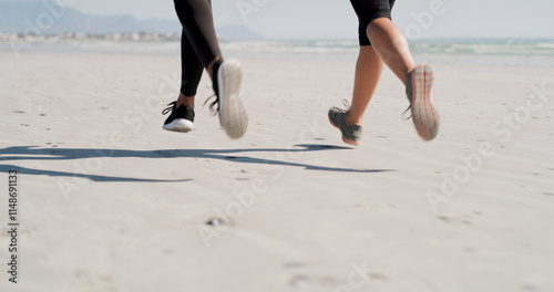 People, legs and running on beach for fitness, exercise and cardio challenge with speed. Friends, shoes and marathon practice at ocean for fast race, competitive and runners on sea sand with energy