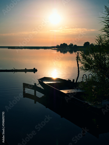 Sunset at the lake with boat
