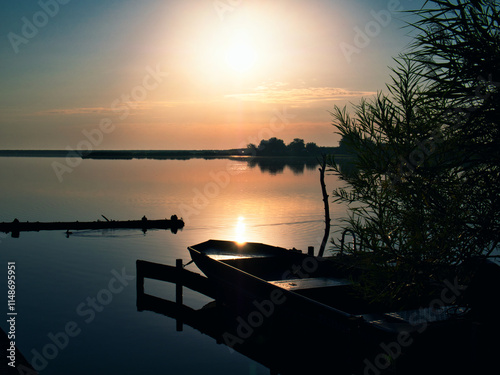 Sunset at the lake with boat
