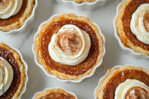 Autumn dessert Mini sugar pies with flaky crust sweet filling and pumpkin spice cream perfect for Halloween photo