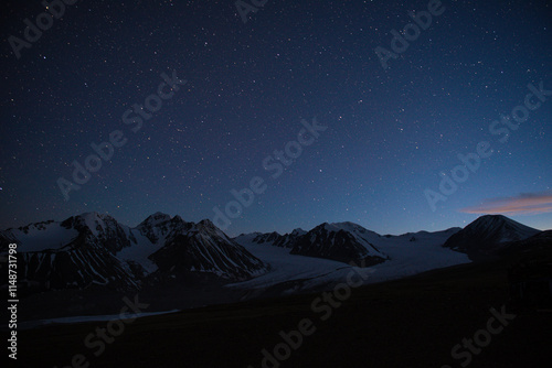 Aerial view of majestic altai mountains with snow and clouds, Altai Tavan Bogd, Mongolia