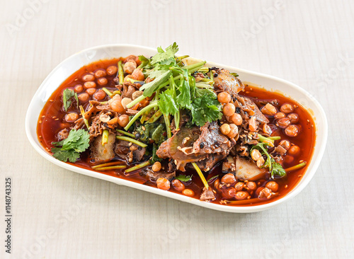 Fuqi Feipian or Sichuan Spicy Beef Salad with coriander and chickpeas served in tray dish isolated on white background side view of hong kong food photo