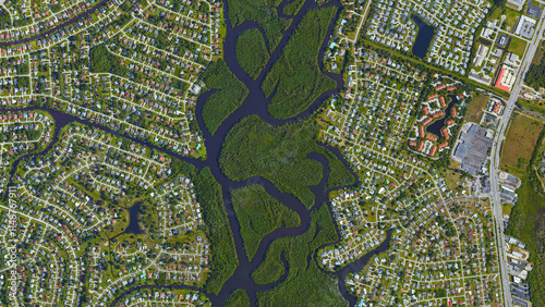 River separating cities, river between two settlements, looking down aerial view from above, Bird’s eye view st lucie river, port st lucie, Florida, USA  photo