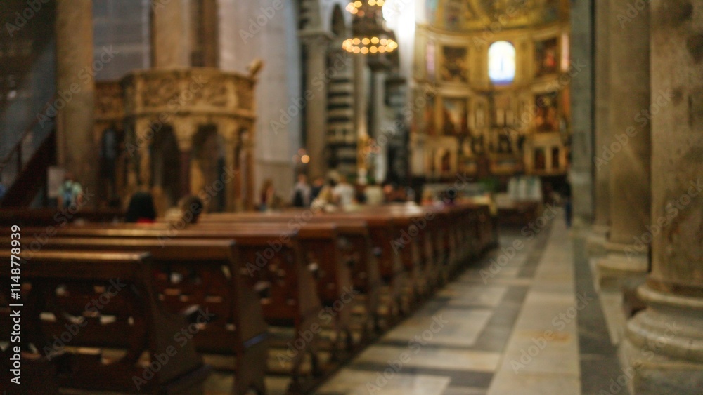 Fototapeta premium Blurred church interior with defocused pews and religious decor, capturing serene atmosphere through bokeh effect highlighting indoor architecture and spiritual ambiance.
